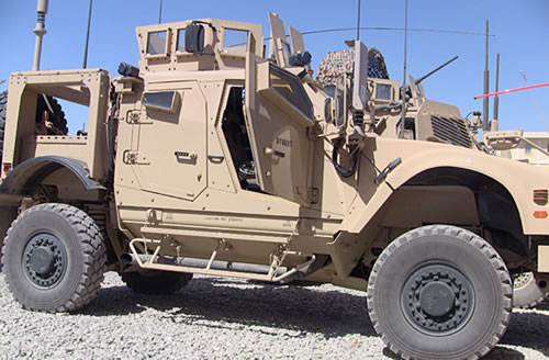 M-ATV armored vehicle with peephole-like side windows.